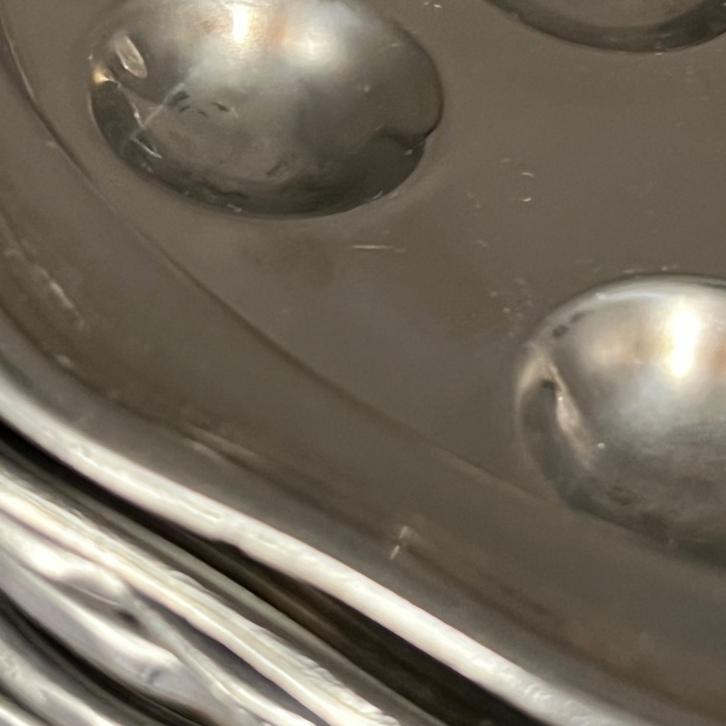 close up stainless steel snail plate
