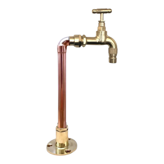 Brass and copper faucet on a white background