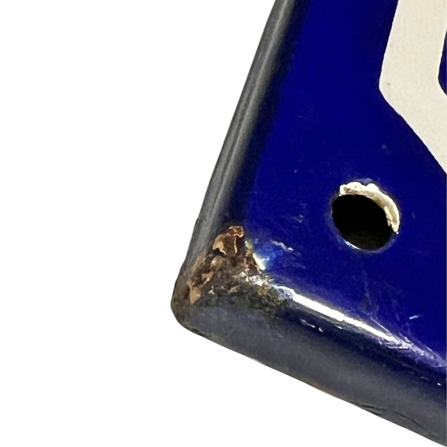 Close-up of a blue and white sign on a white background