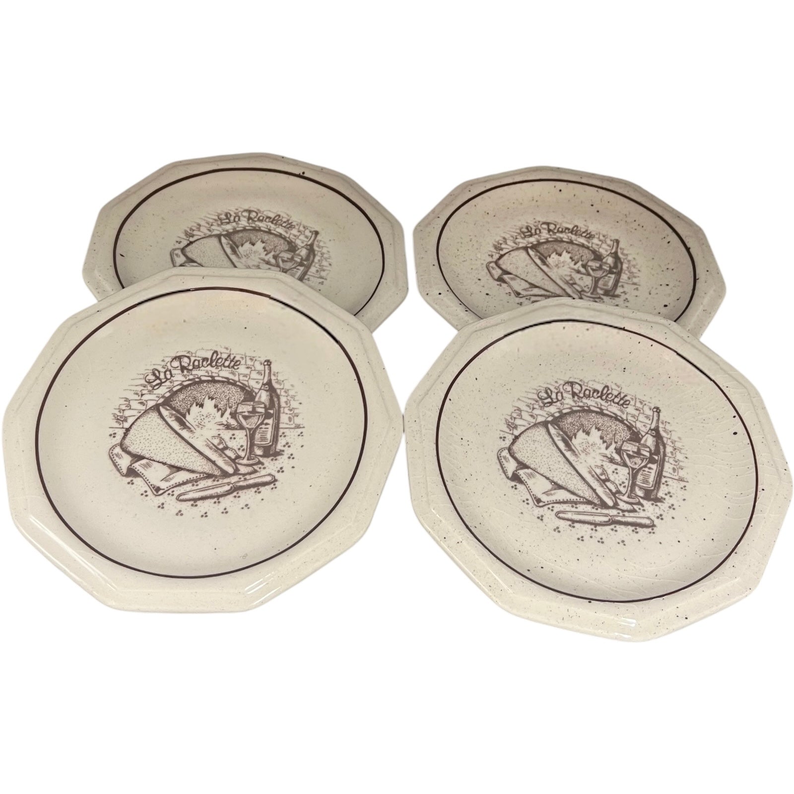 Set of 4 La Raclette plates with a decorative design on a white background