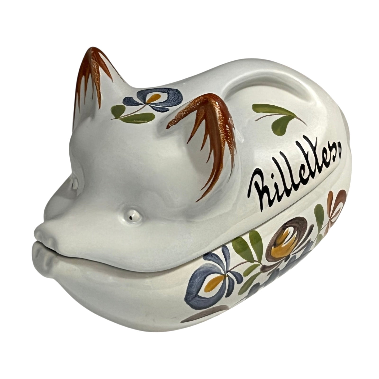 Ceramic pig-shaped container with floral designs and 'Rillettes' text on a white background