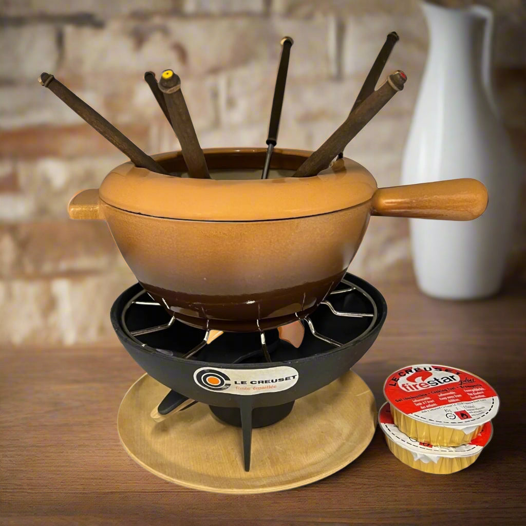 Le Creuset fondue set in beige and brown with a stand and forks