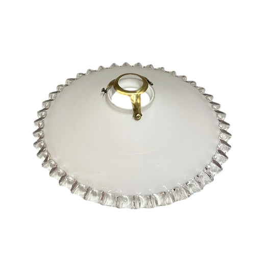 White lampshade with decorative rim on a white background