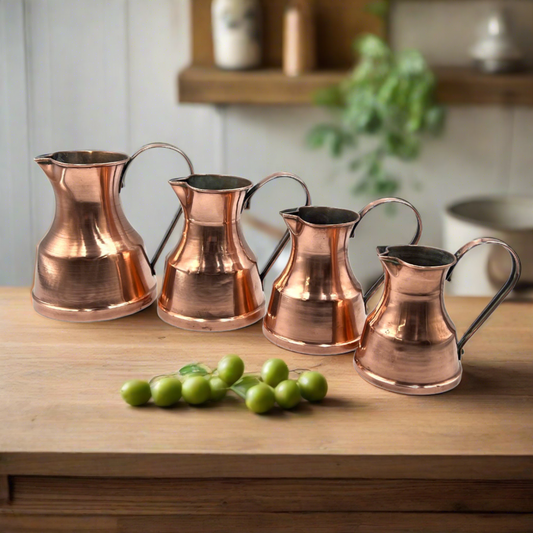 Set of 4 French vintage copper tankards or measuring cups 