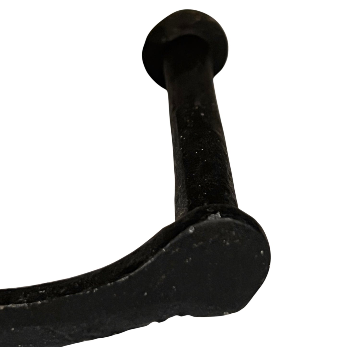 Close up of cow toilet paper holder with black and white pattern on a white background