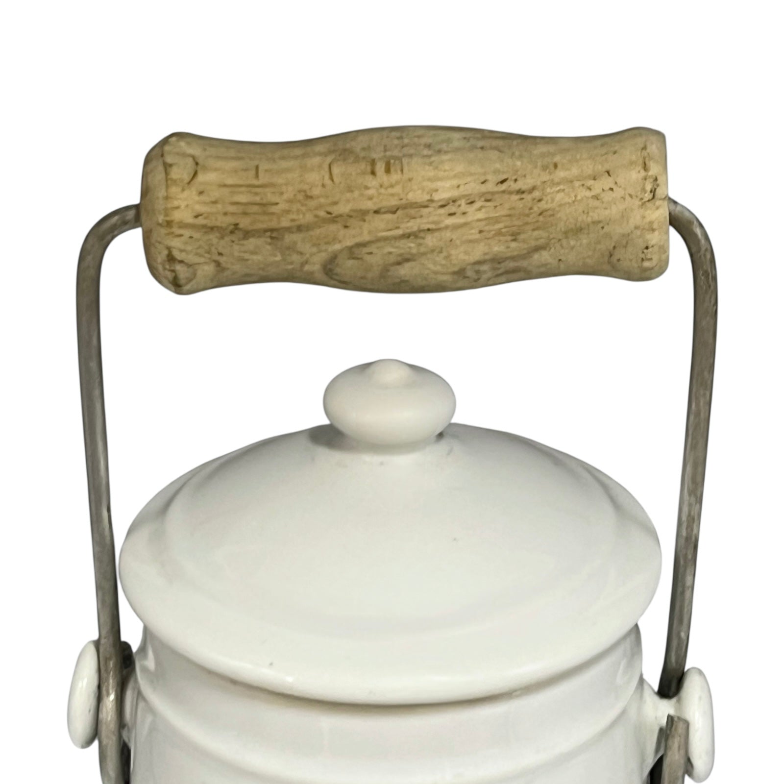 White ceramic churn with a wooden handle on a white background