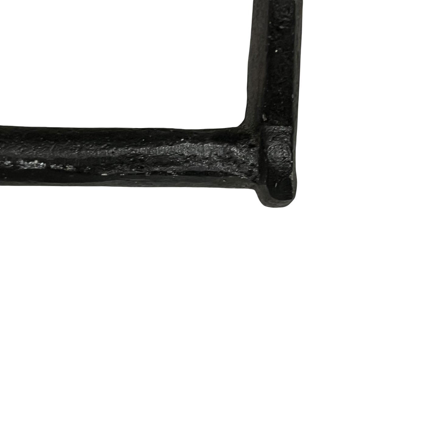 Close-up of a black cast iron or heavy metal frame corner on a plain white background.