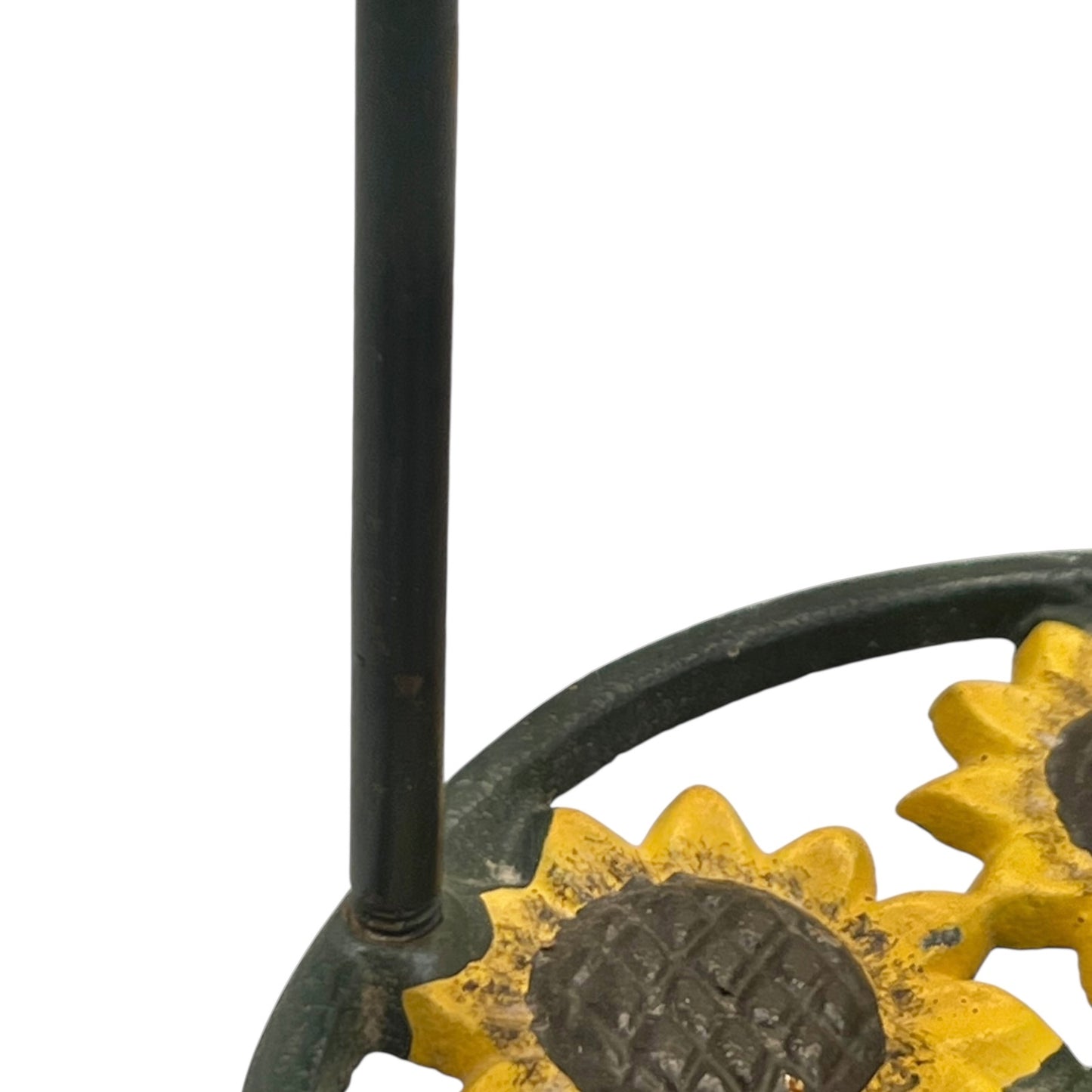 Close-up of a sunflower decoration on a kitchen paper towel stand on a white background