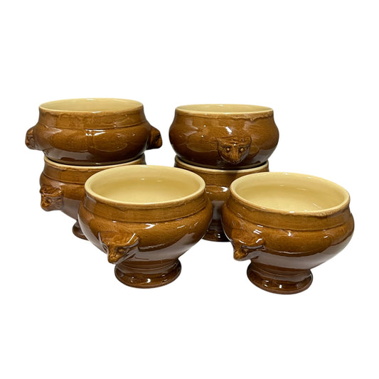 six brown glazed ceramic animal-headed bowls arranged together on a plain white background.