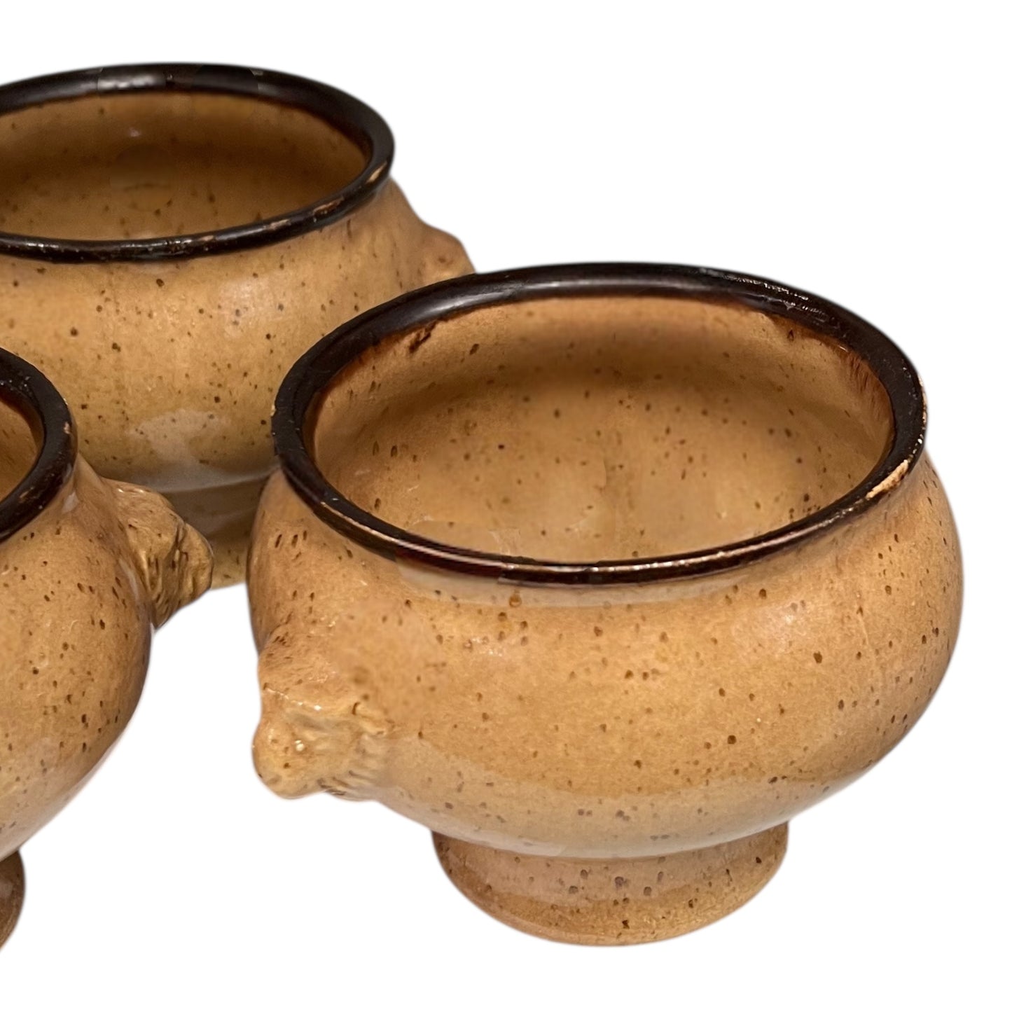 close up of soup bowls on a white background