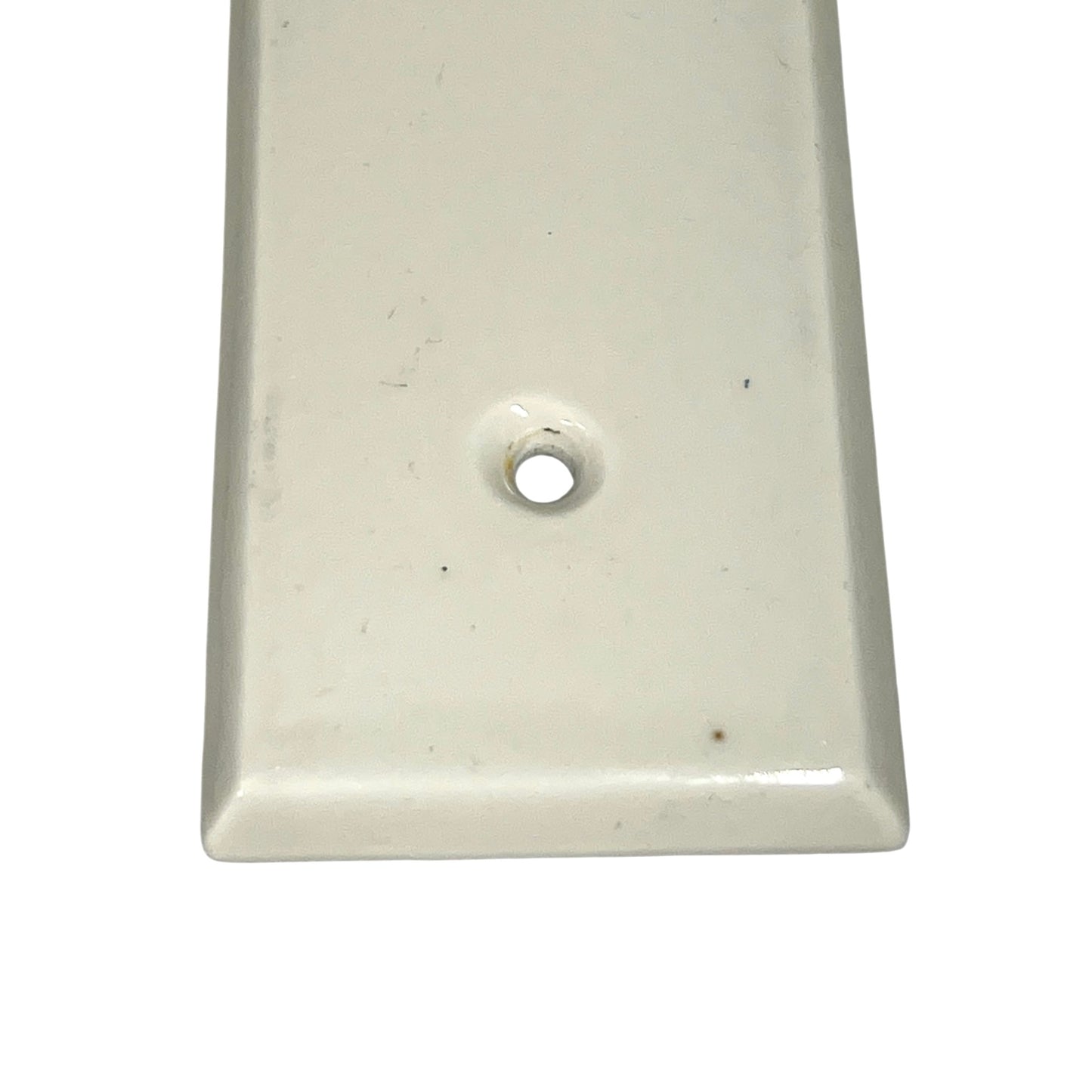 Close up of a finger push plate on a white background
