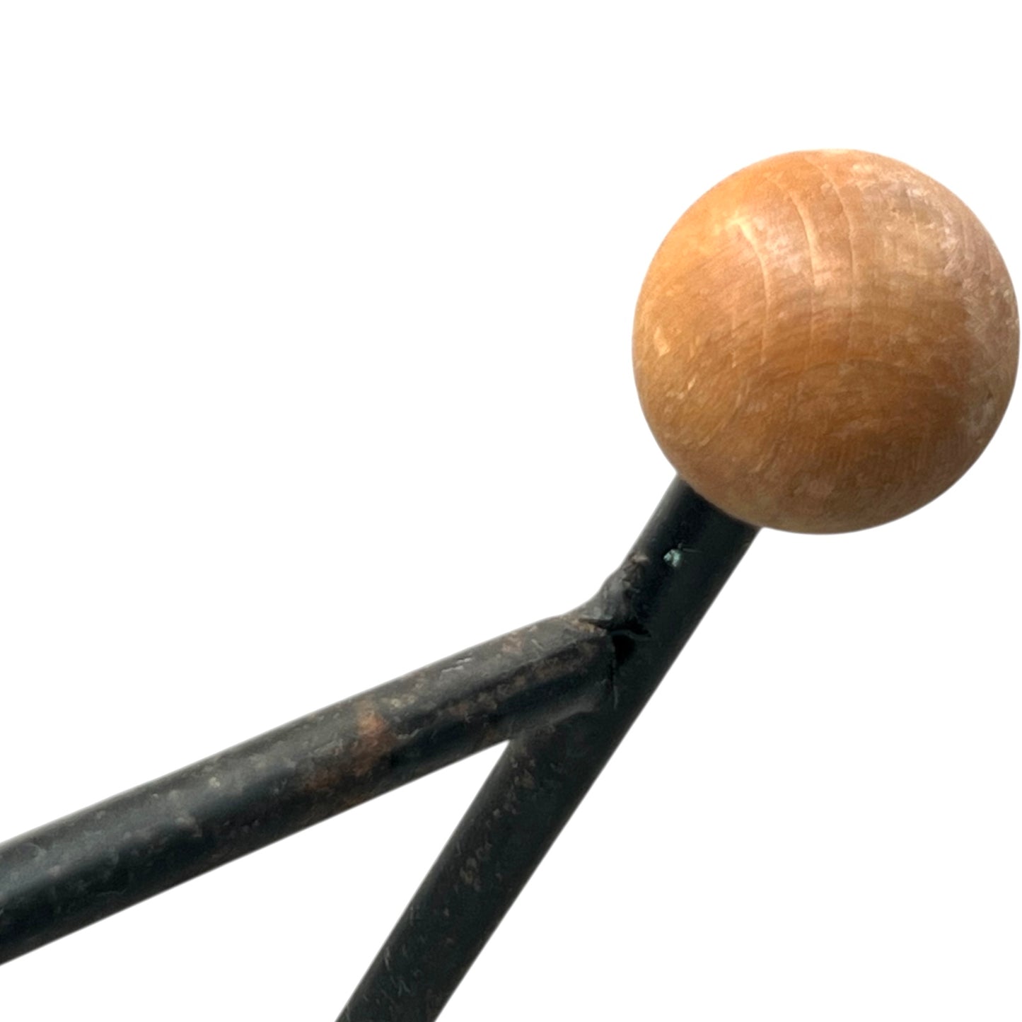 Close-up of a black metal stand on a white background