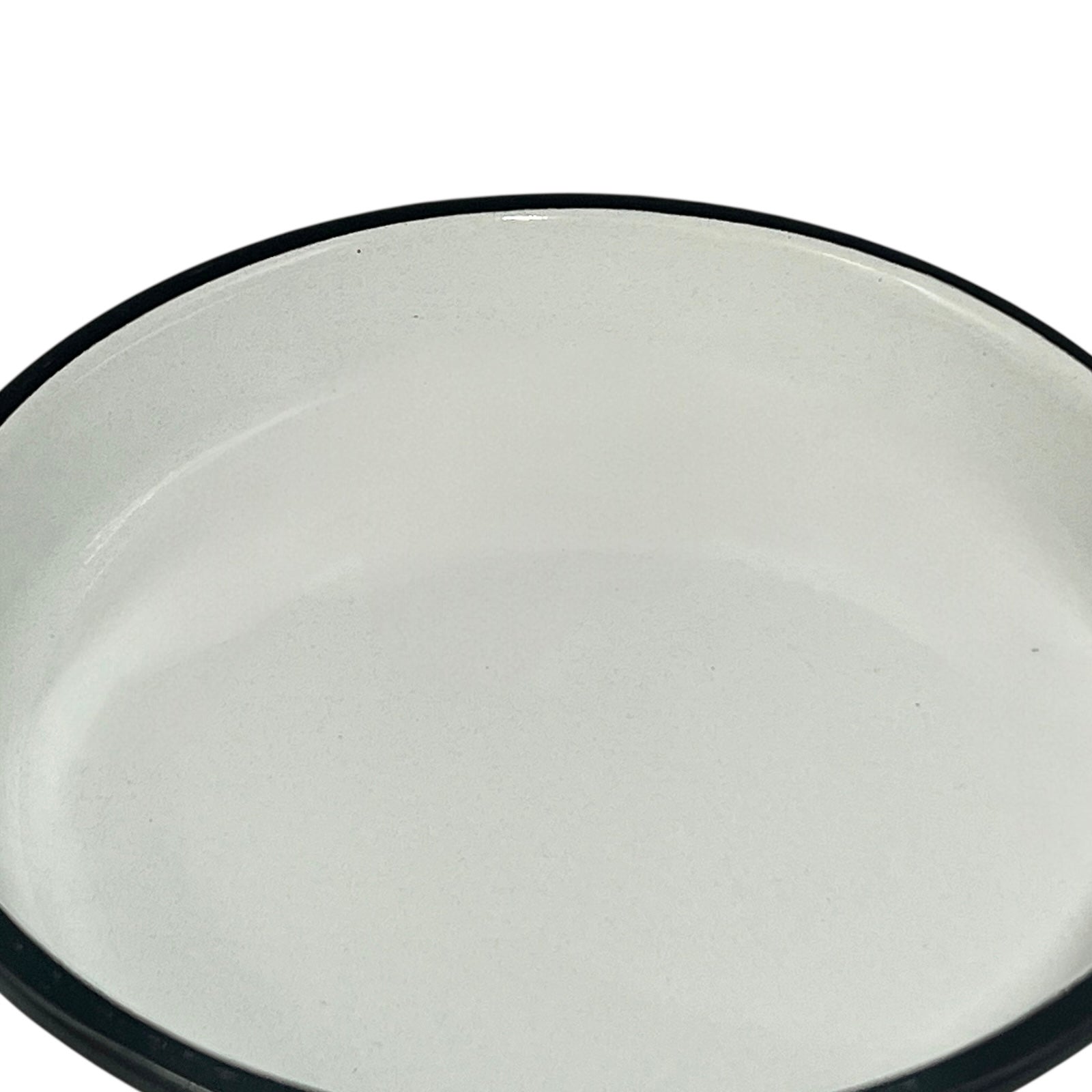 Green frying pan with a white interior on a white background