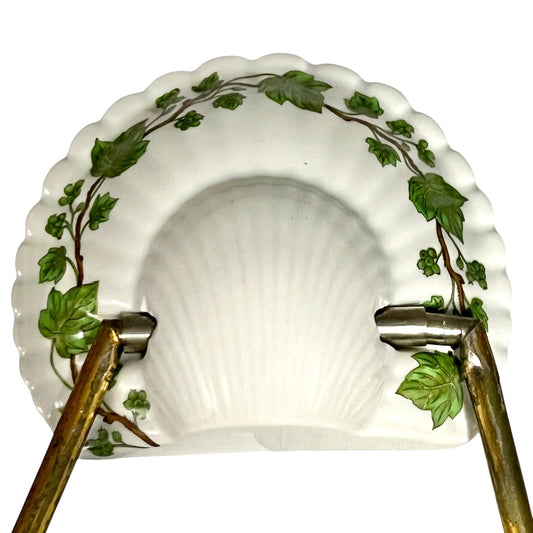 Decorative towel hoop with leaf design on a white background
