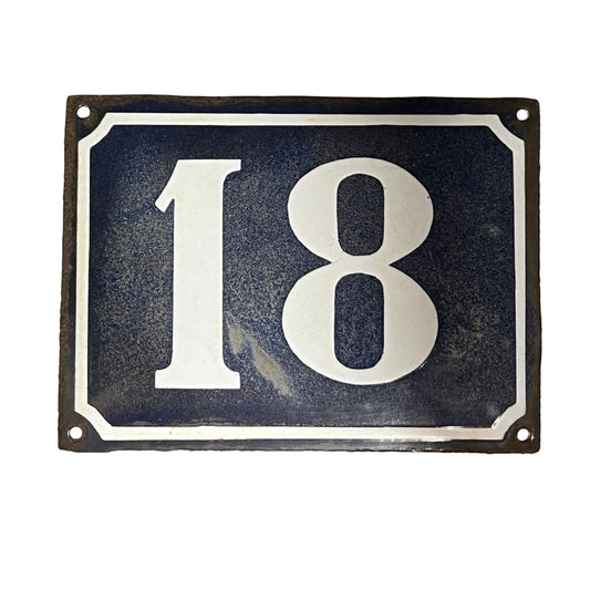 Blue and white door number 18 set on a white background