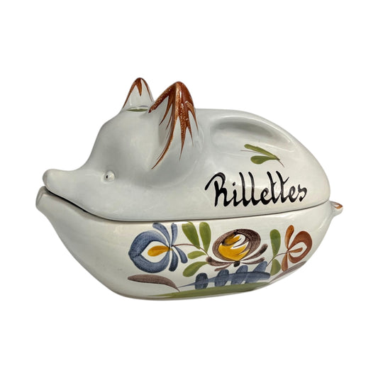 Ceramic pig-shaped container with floral designs and 'Rillettes' text on a white background