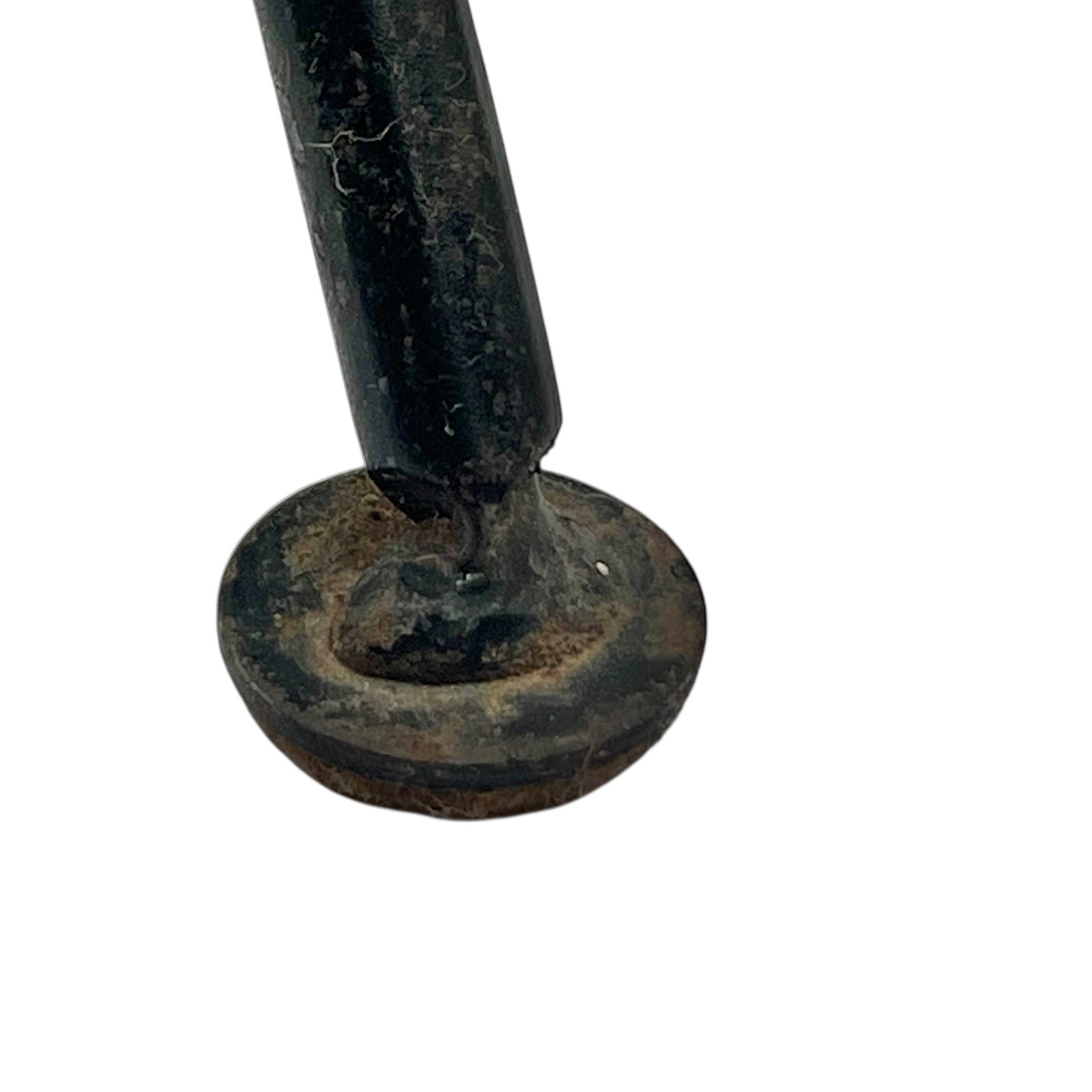 Close-up of a black metal stand on a white background