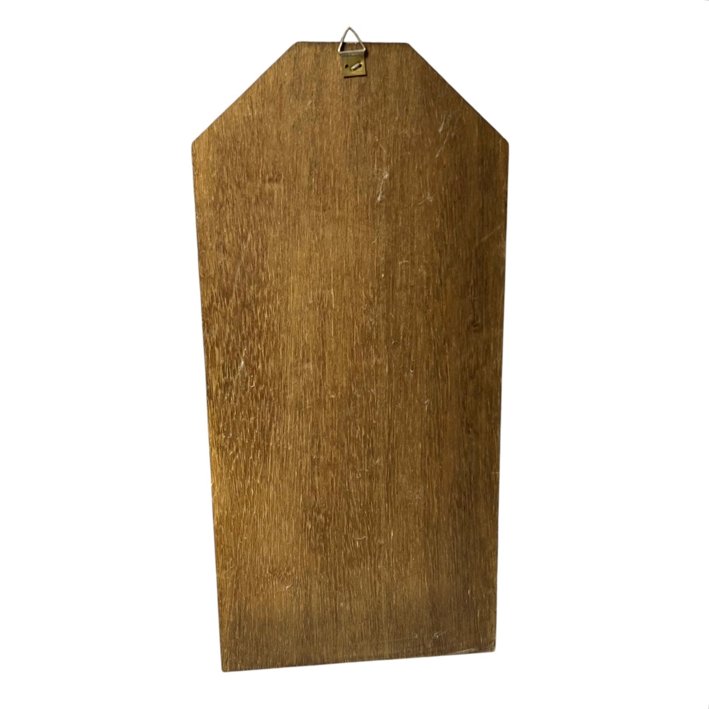 A rustic wooden wall plaque with a pointed top and a small metal hanging loop, featuring a natural wood grain texture on a plain white background.