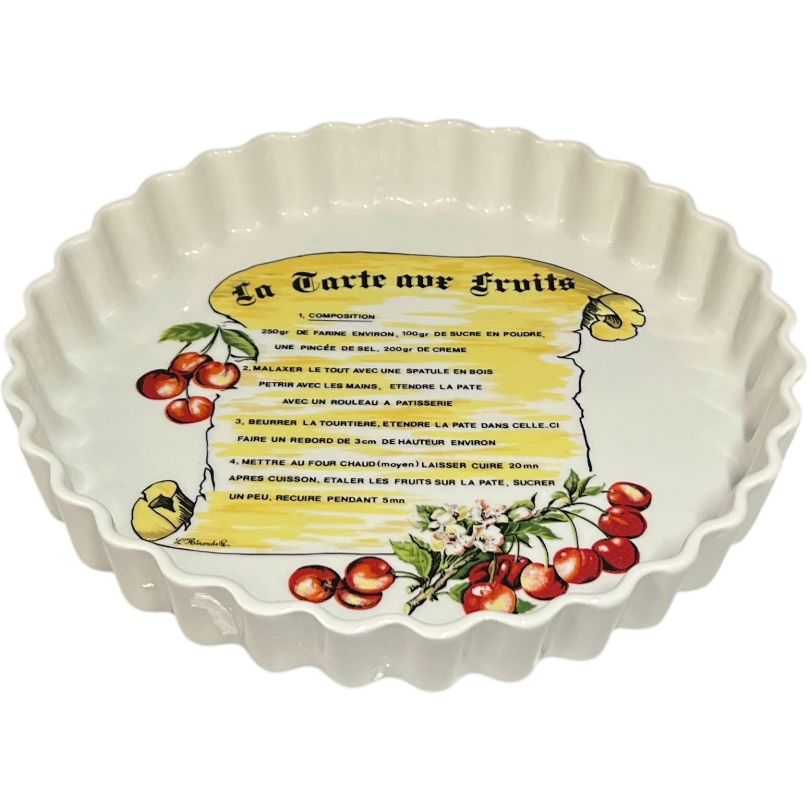 Ceramic tart dish with fruit-themed design and recipe text on a white background