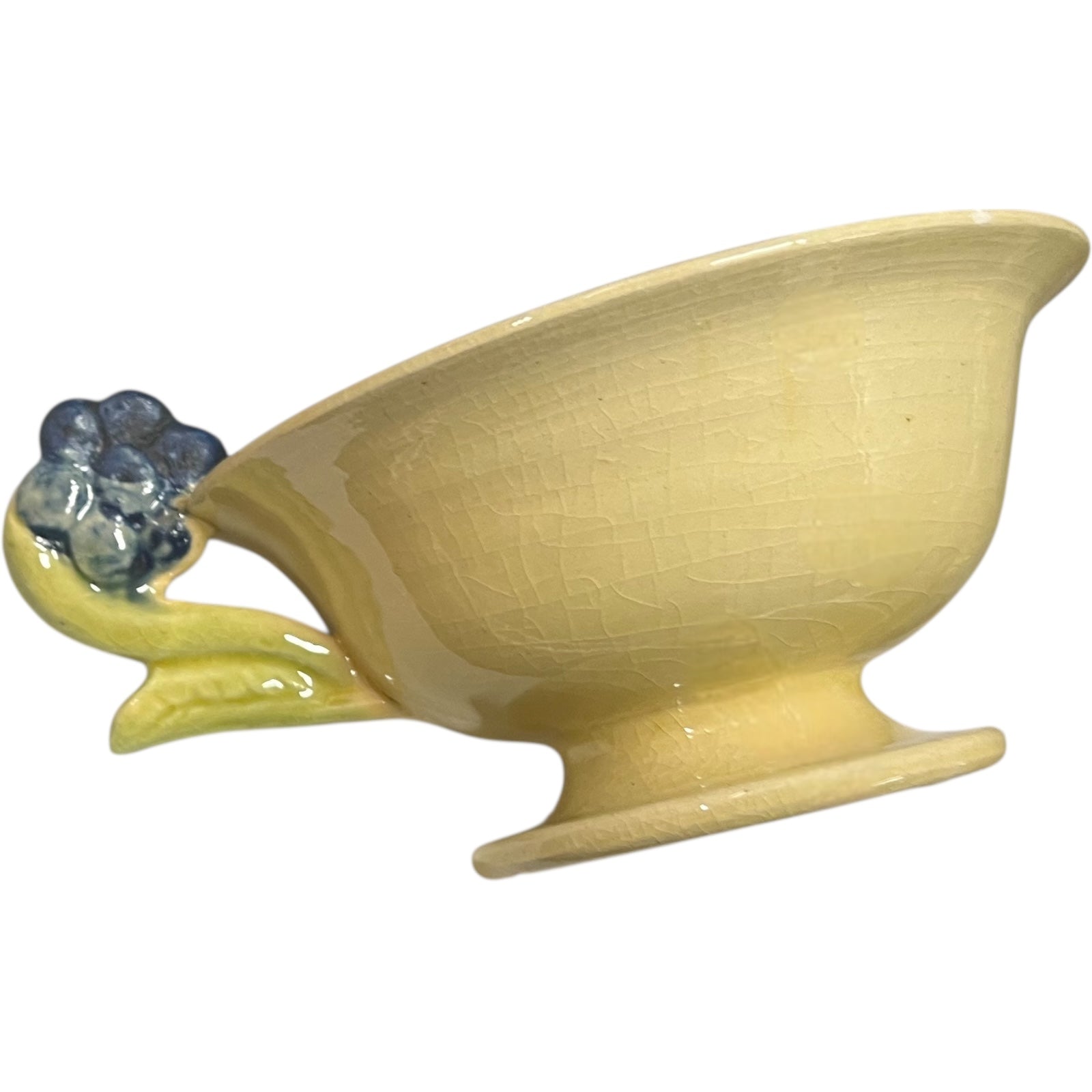 Yellow ceramic bowl with floral design on a white background