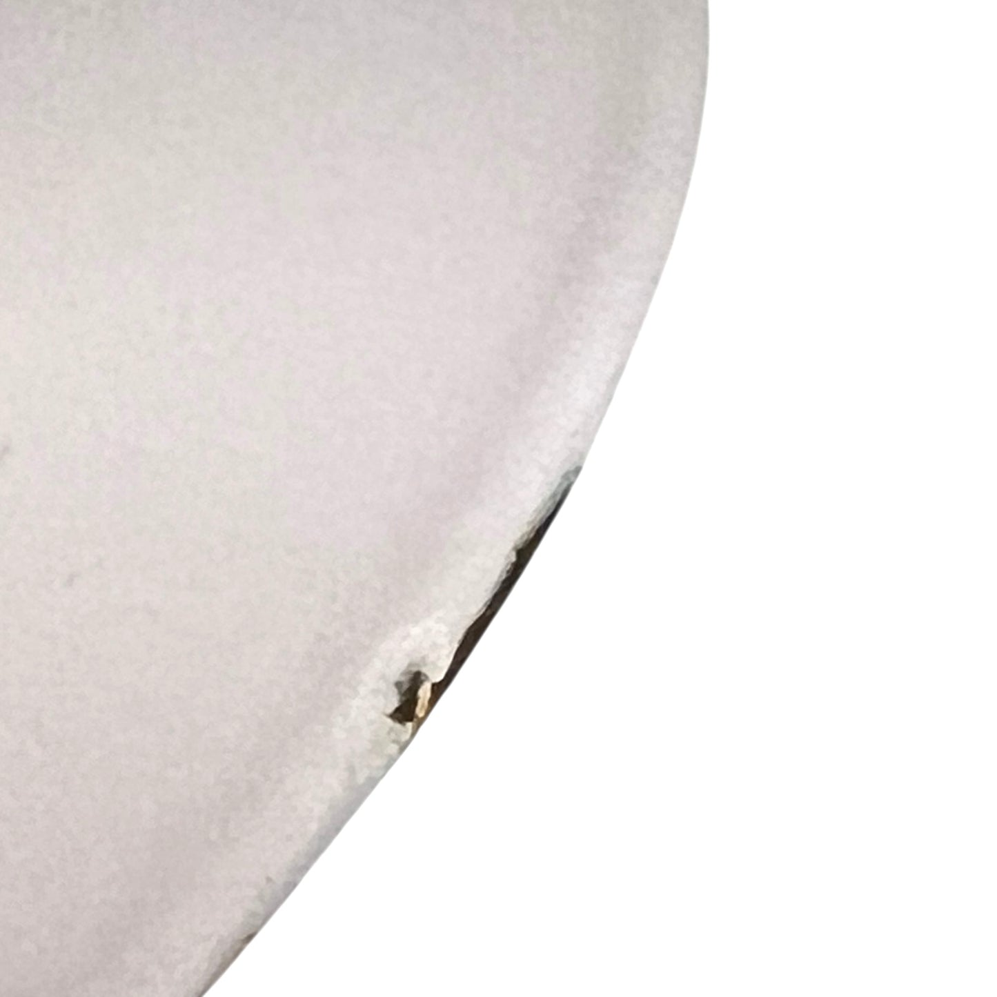 Close up of a Le Creuset pot on a white background