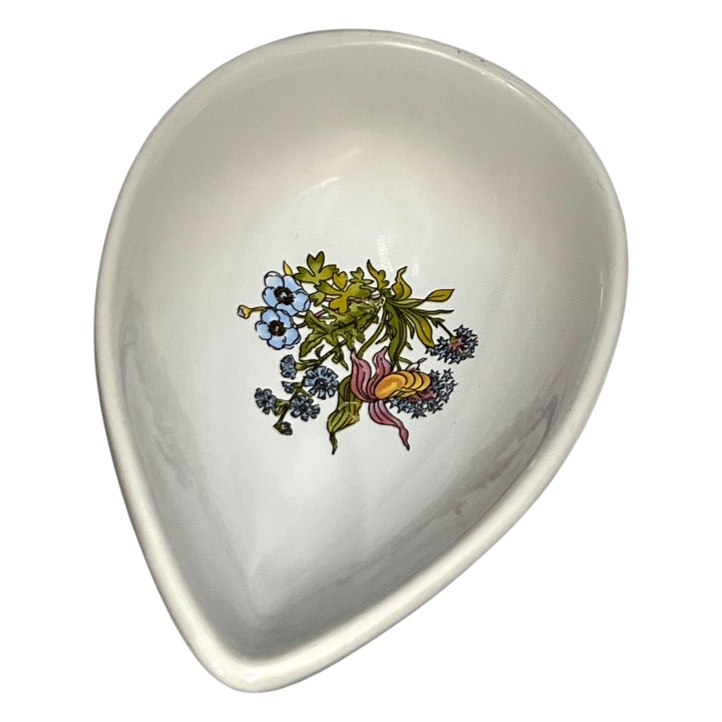 teardrop-shaped ceramic dish with floral design on a white background