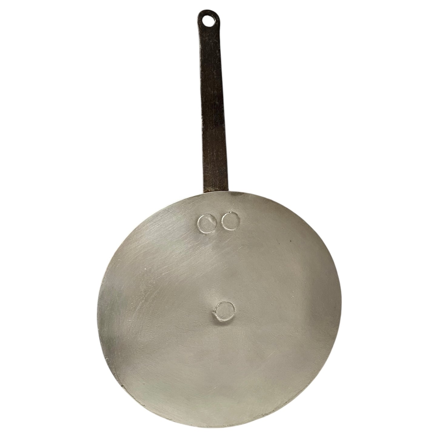 Close-up of a copper pan lid with brand new tin lining on a white background