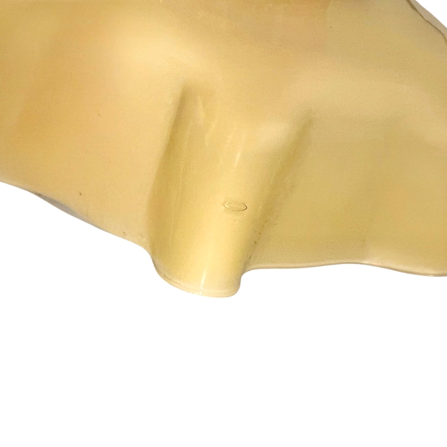 close up of Vintage-style pendant light with a yellow glass shade and brass fitting on a white background