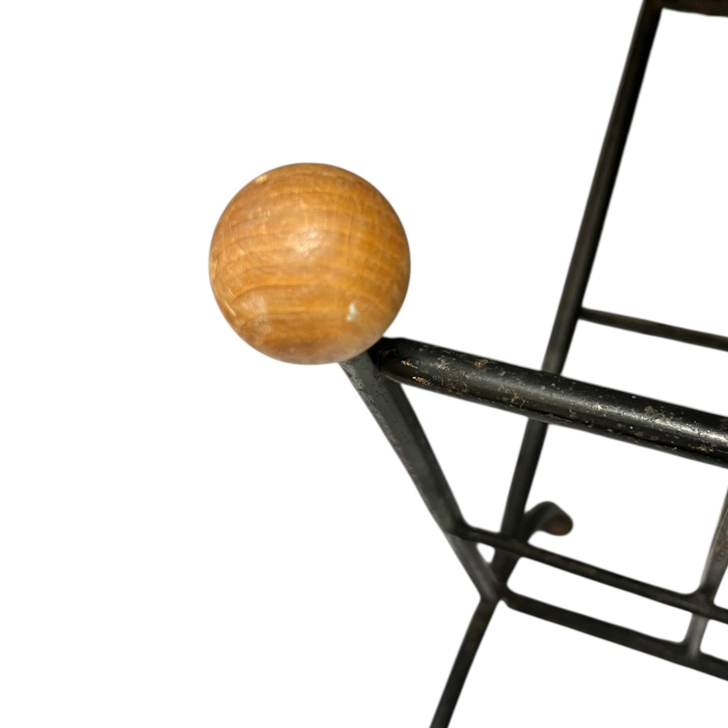 Close-up of a black metal stand on a white background