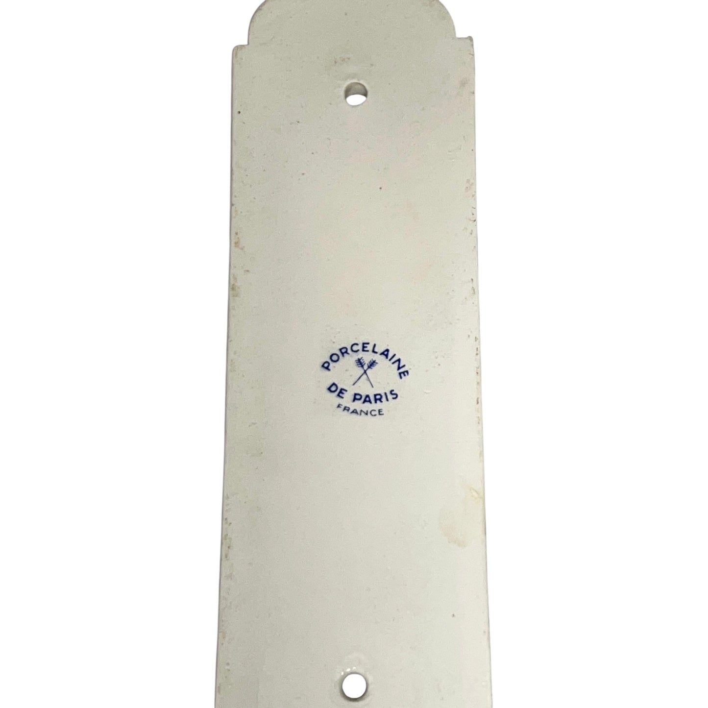 Close up of the back of a finger push plates on a white background