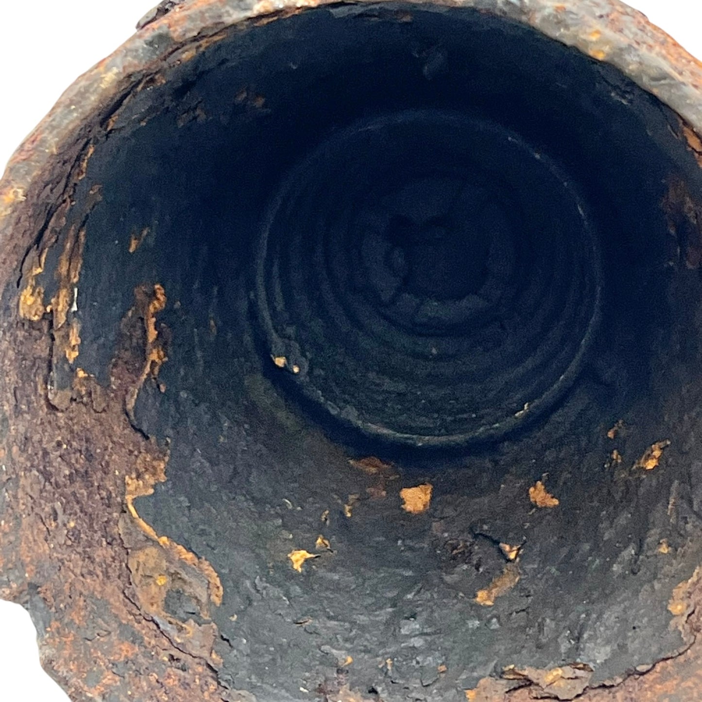 Close up of WW1 brass fuse on a white background