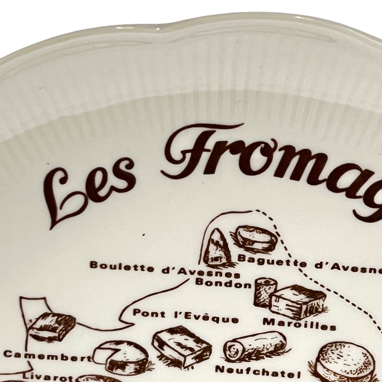 White plate with 'Les Fromages de France' design on a white background