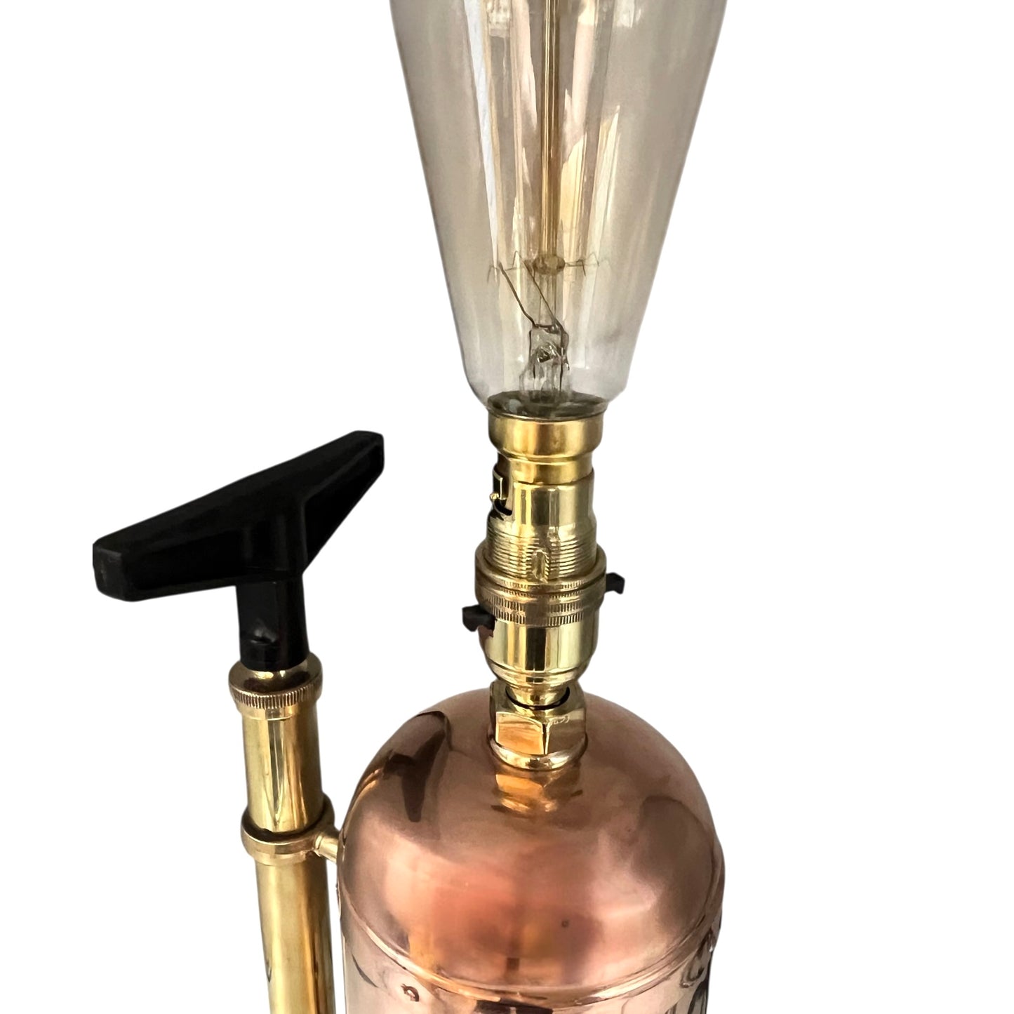 Vintage-style lamp with copper base, brass fitting, and clear glass bulb on a white background