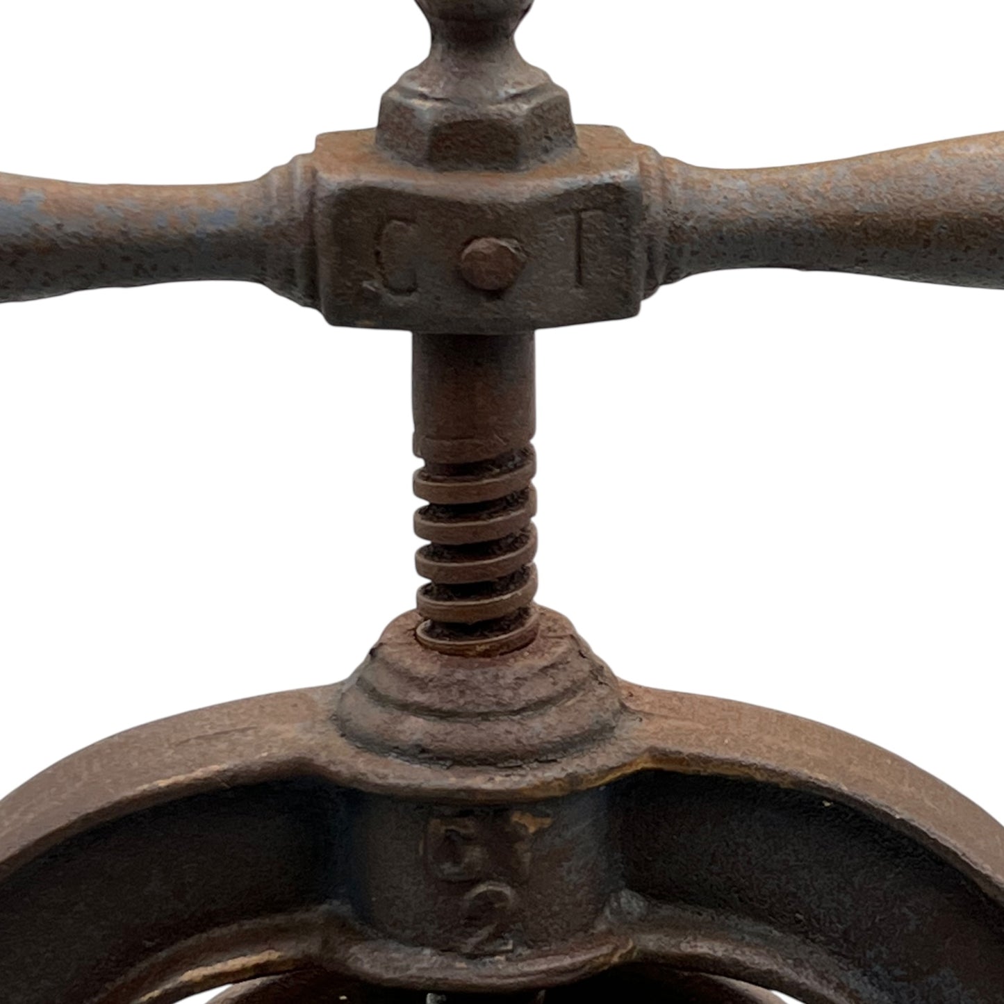 Close-up of a rusty metal lever mechanism of a fruit press on a white background