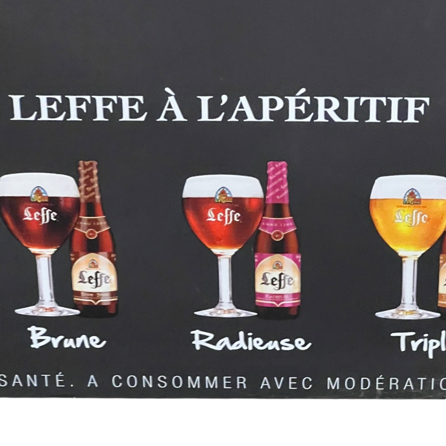 Advertisement for Leffe beer with various bottles and glasses on a black background