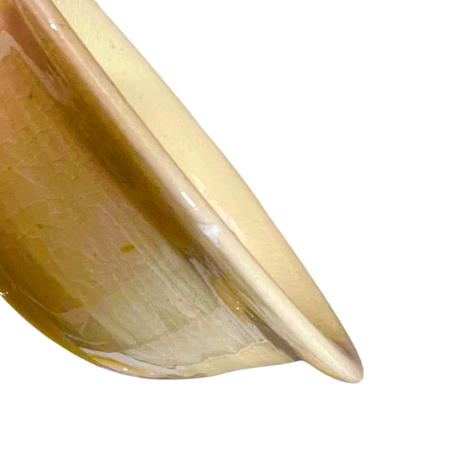 Close-up of a smooth, curved surface on a white background