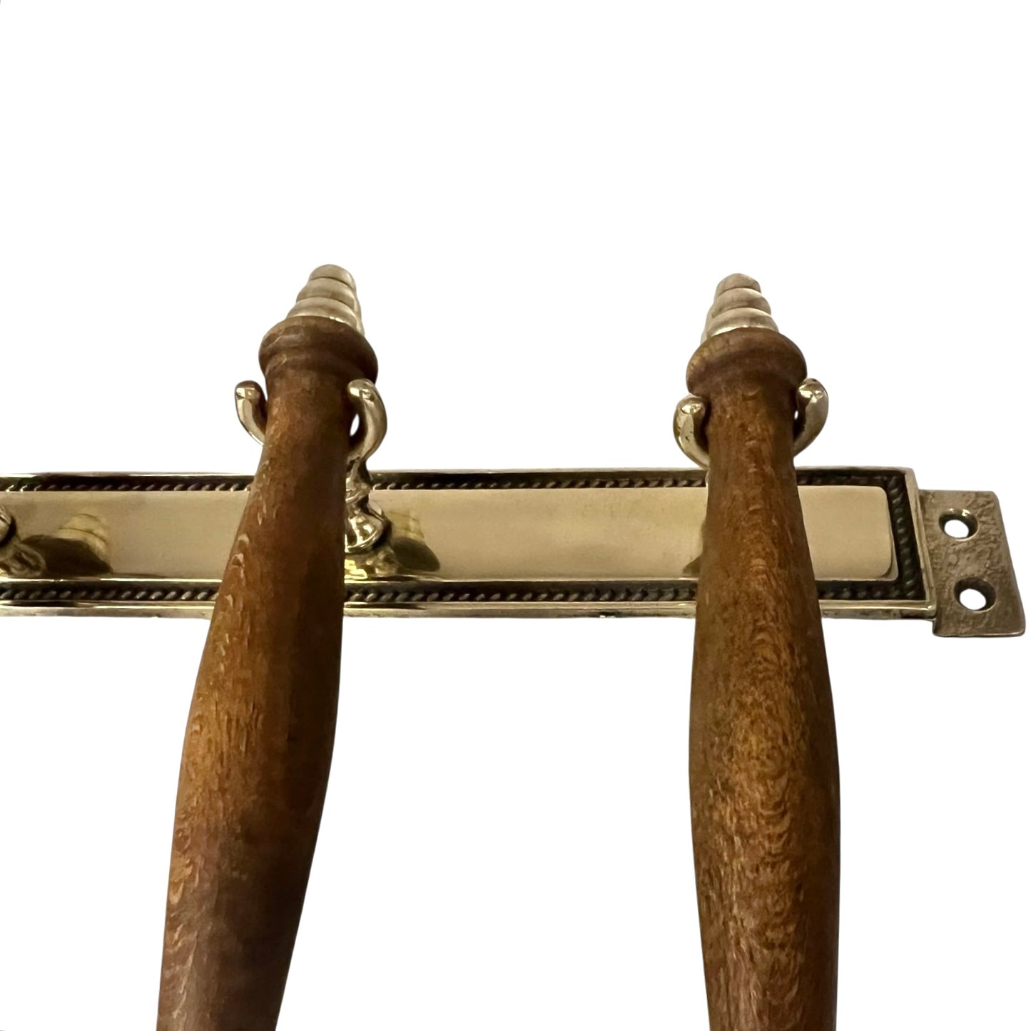 Pair of wooden handles with brass hardware on a white background