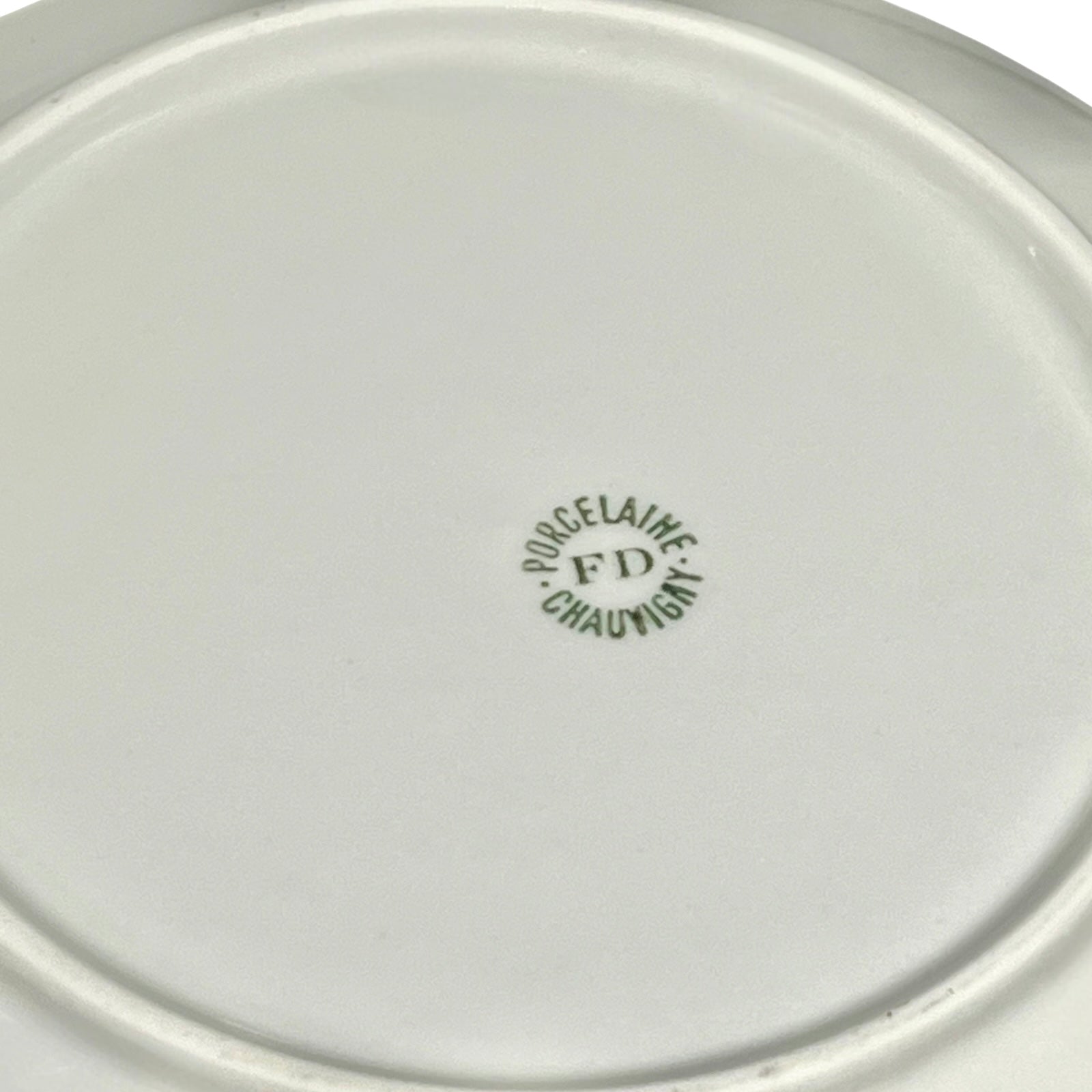 Close-up of a white ceramic plate with 'Porcelaine FD Chauvigny' branding.