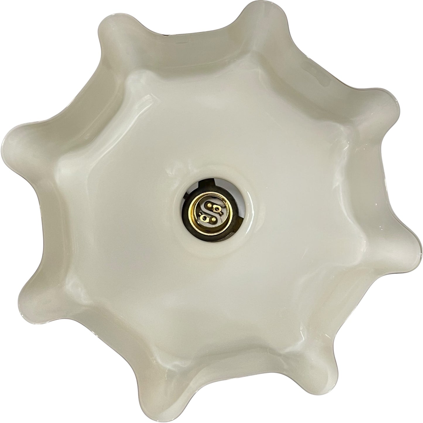Close-up of a yellow glass shade from inside on a white background