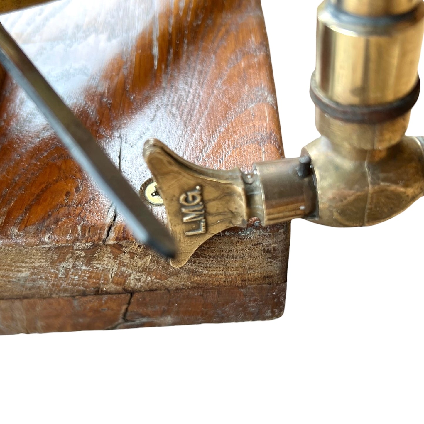 close up of a French copper garden sprayer on a white background