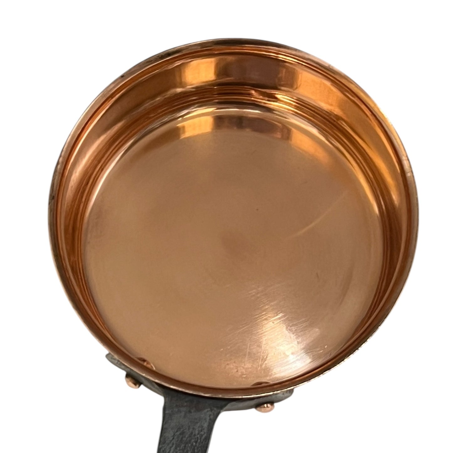 Copper-bottomed pan on a white background