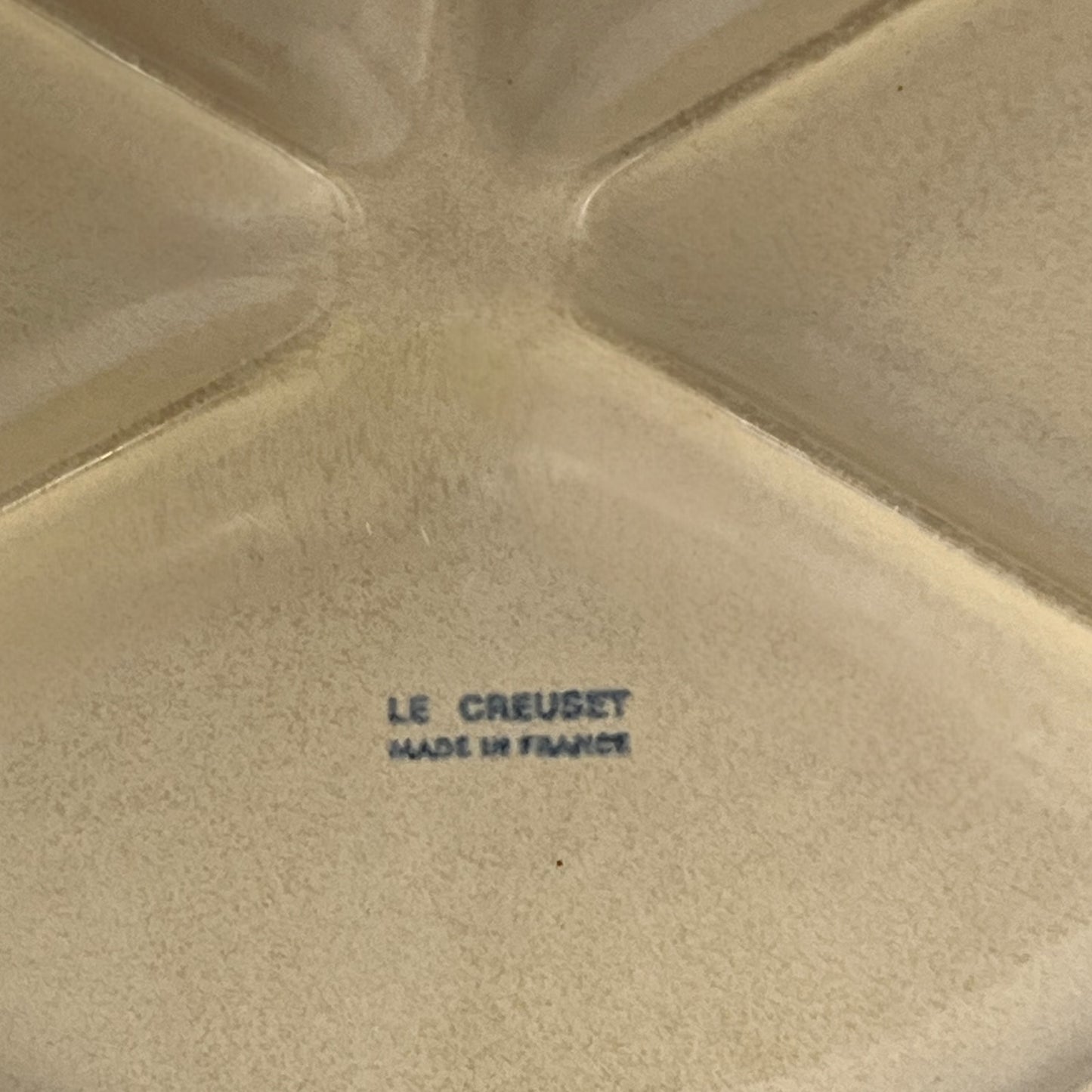 Le Creuset stamp on the back of a plate
