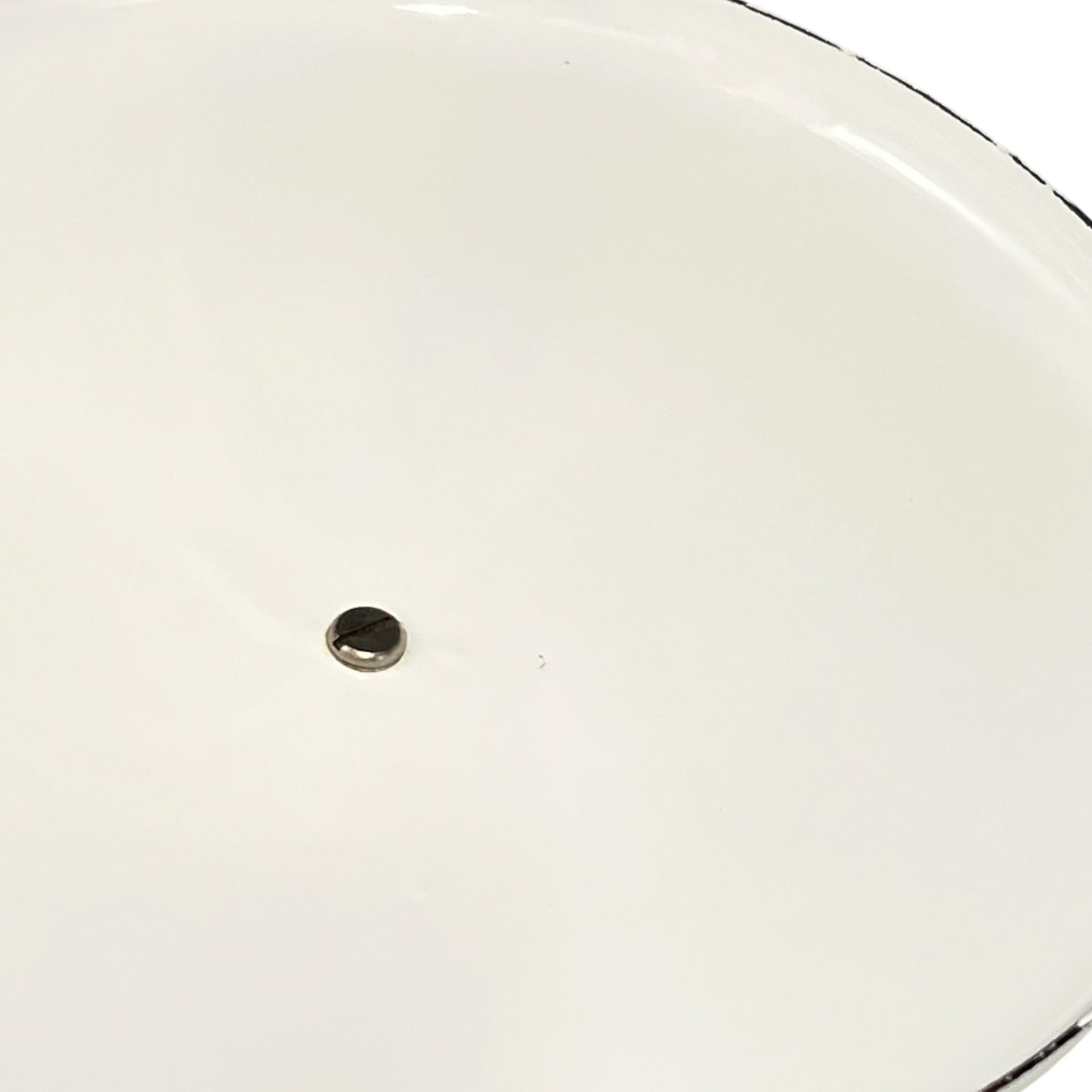 close up of White enamel saucepan lid inside on a white background