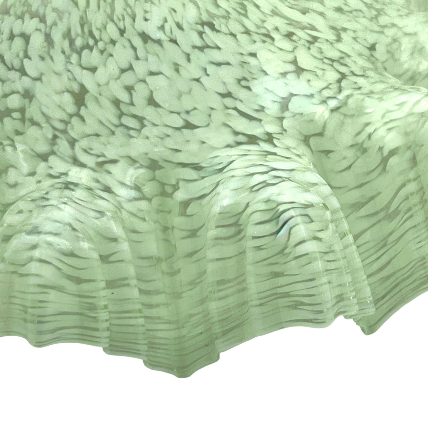 close up of light green milk glass pendant shade on a white background