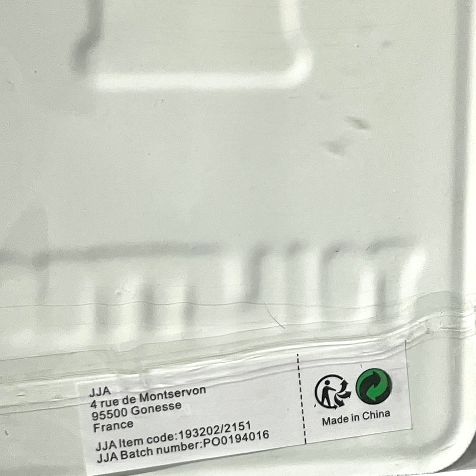 Close-up of a label containing text and logos.