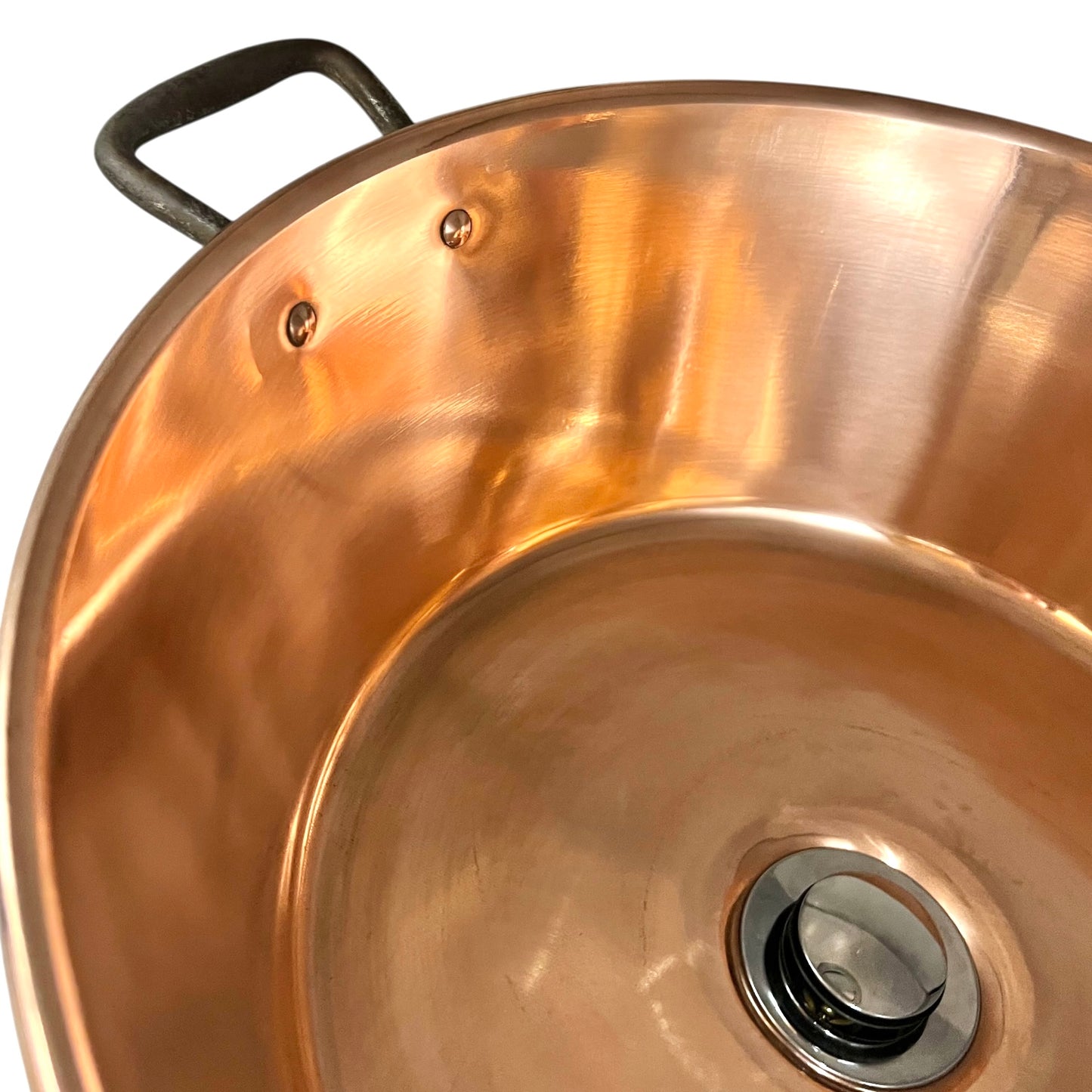 French copper bowl upcycled into a copper sink with iron handles and a chrome pop up waste on a white background