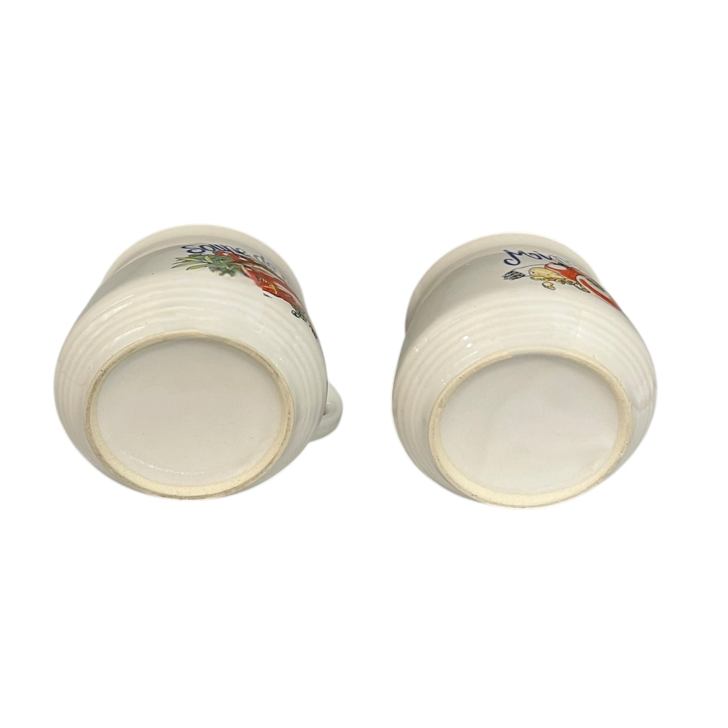 Two ceramic cups with floral patterns on a white background