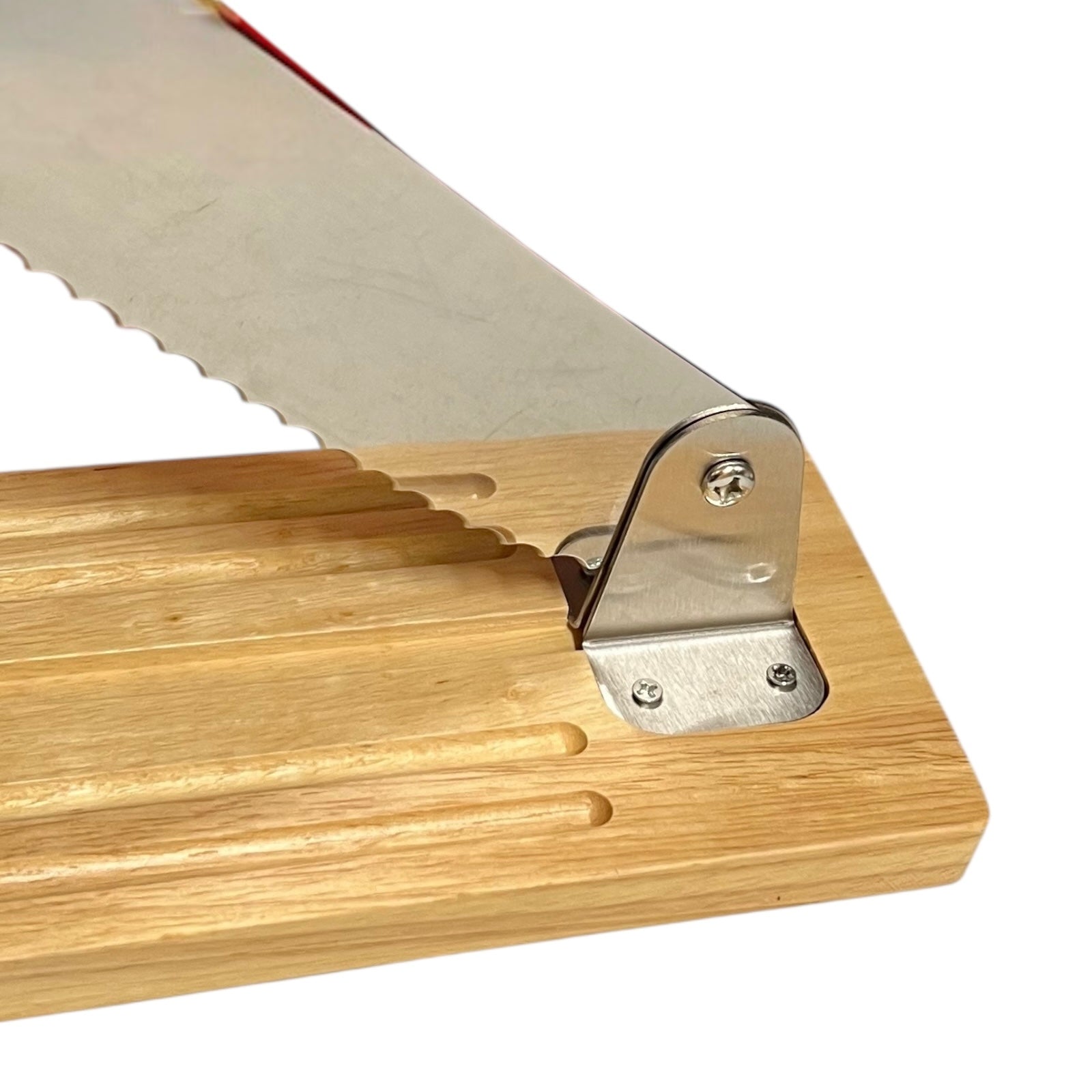 close up of baguette cutter on a white background