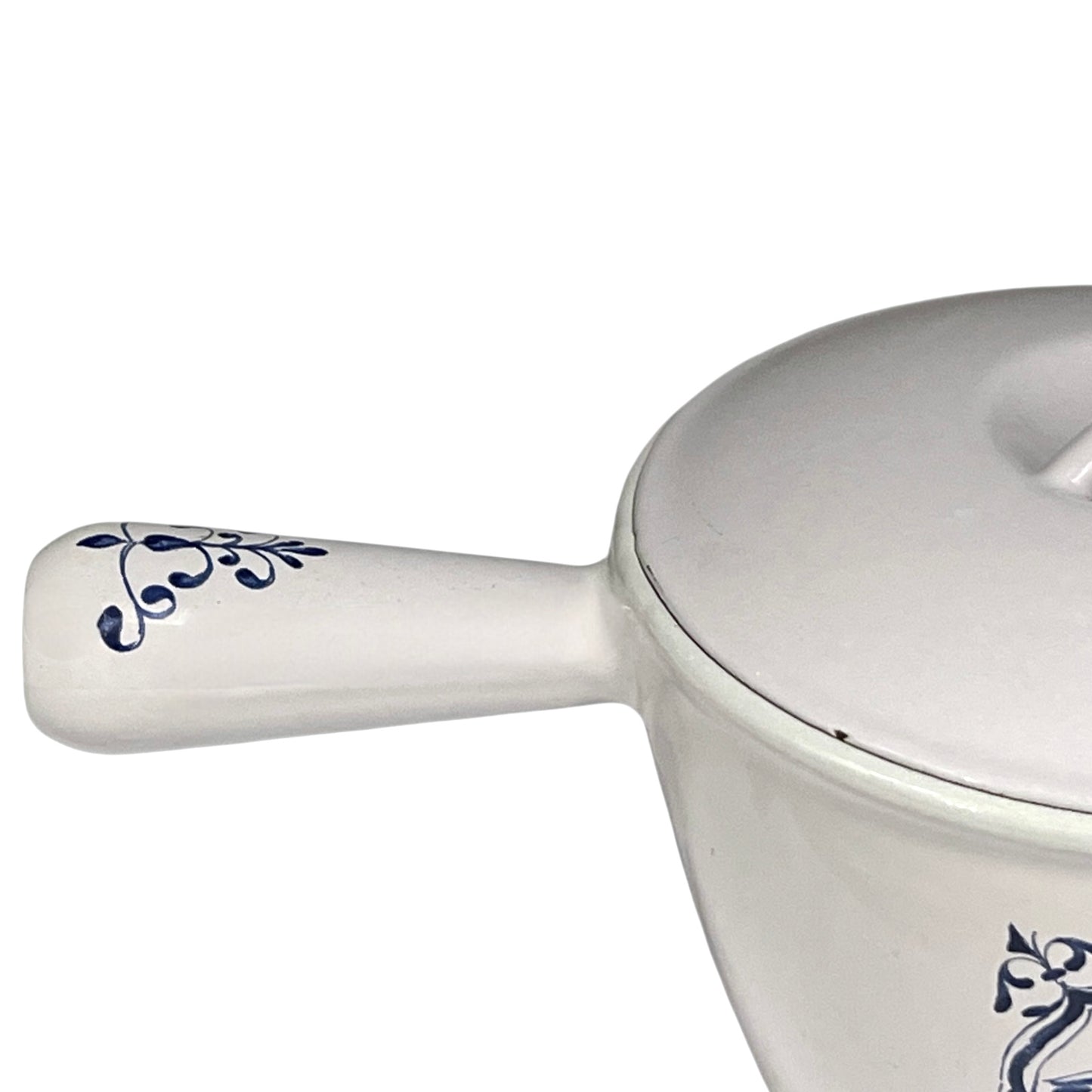 White enamelled cast iron pot with blue floral design and handle on a white background