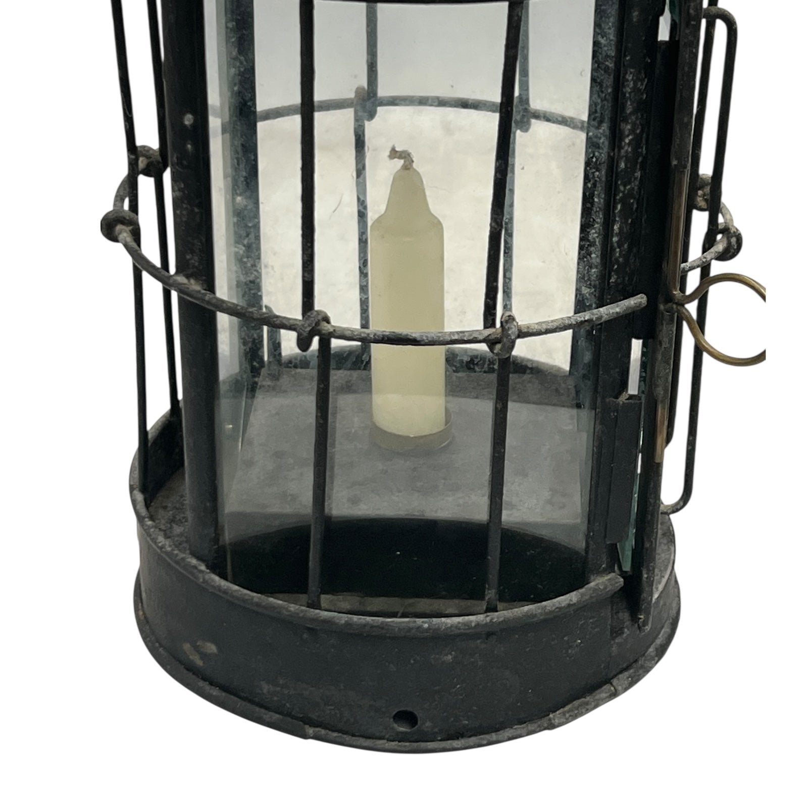 Vintage black metal lantern with glass cover on a white background